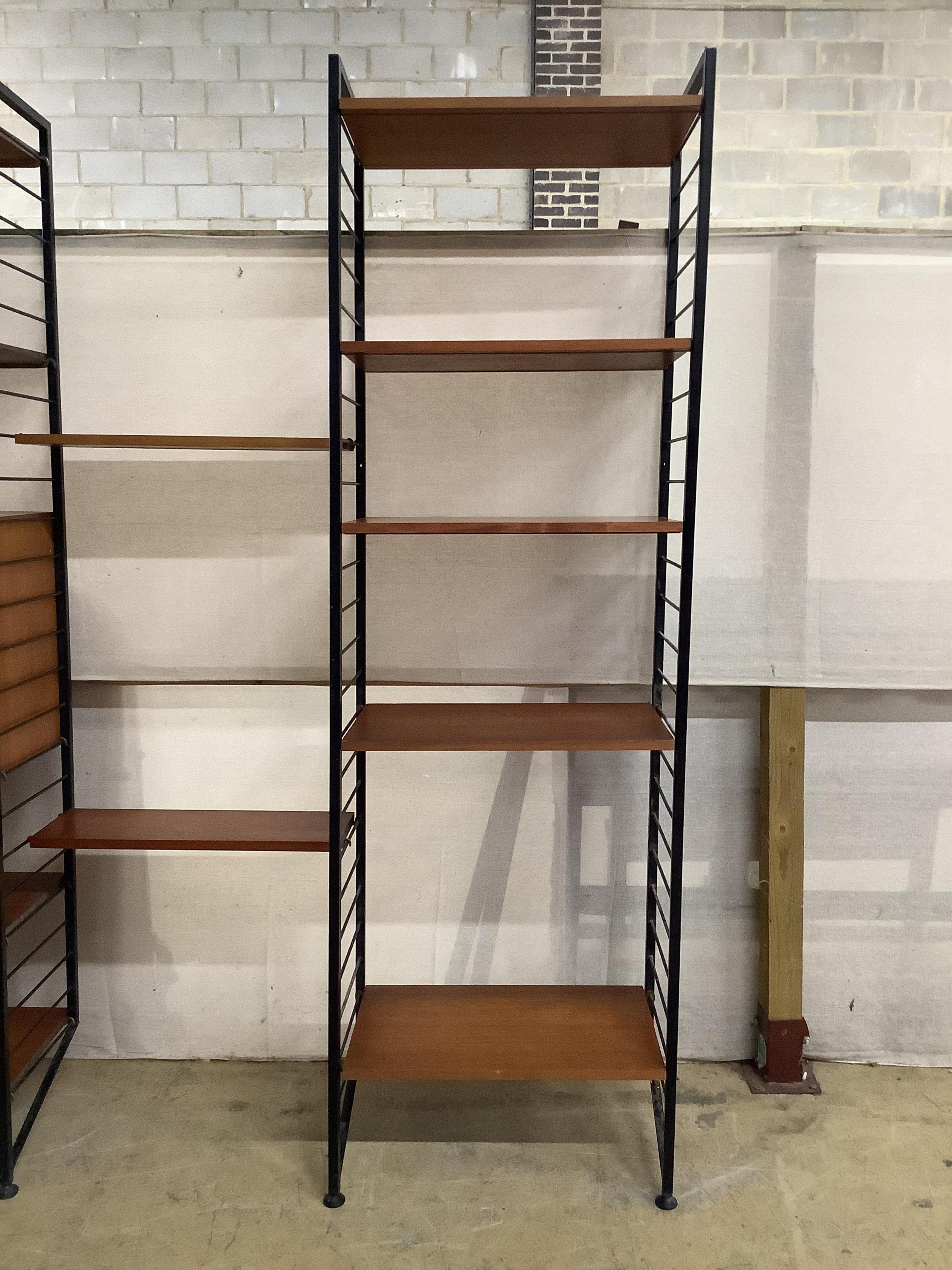 A mid century teak Ladderax shelving unit, width 215cm, depth 35cm, height 201cm. Condition - good